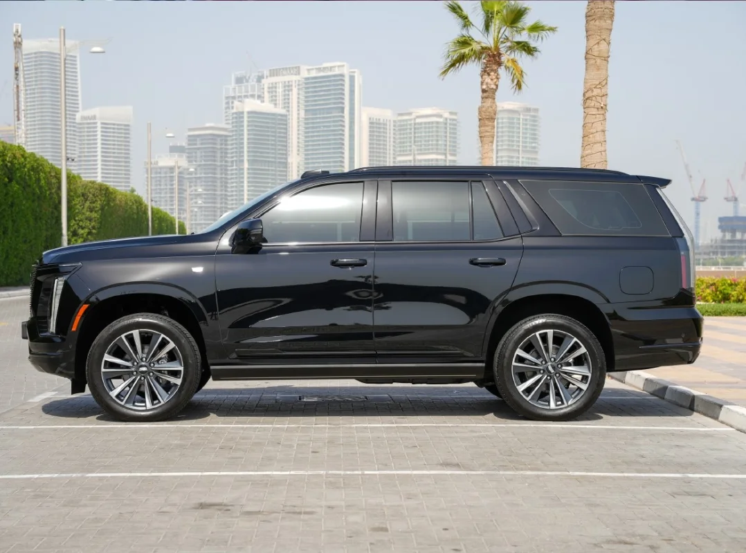 Luxury car driving in Dubai with skyline view