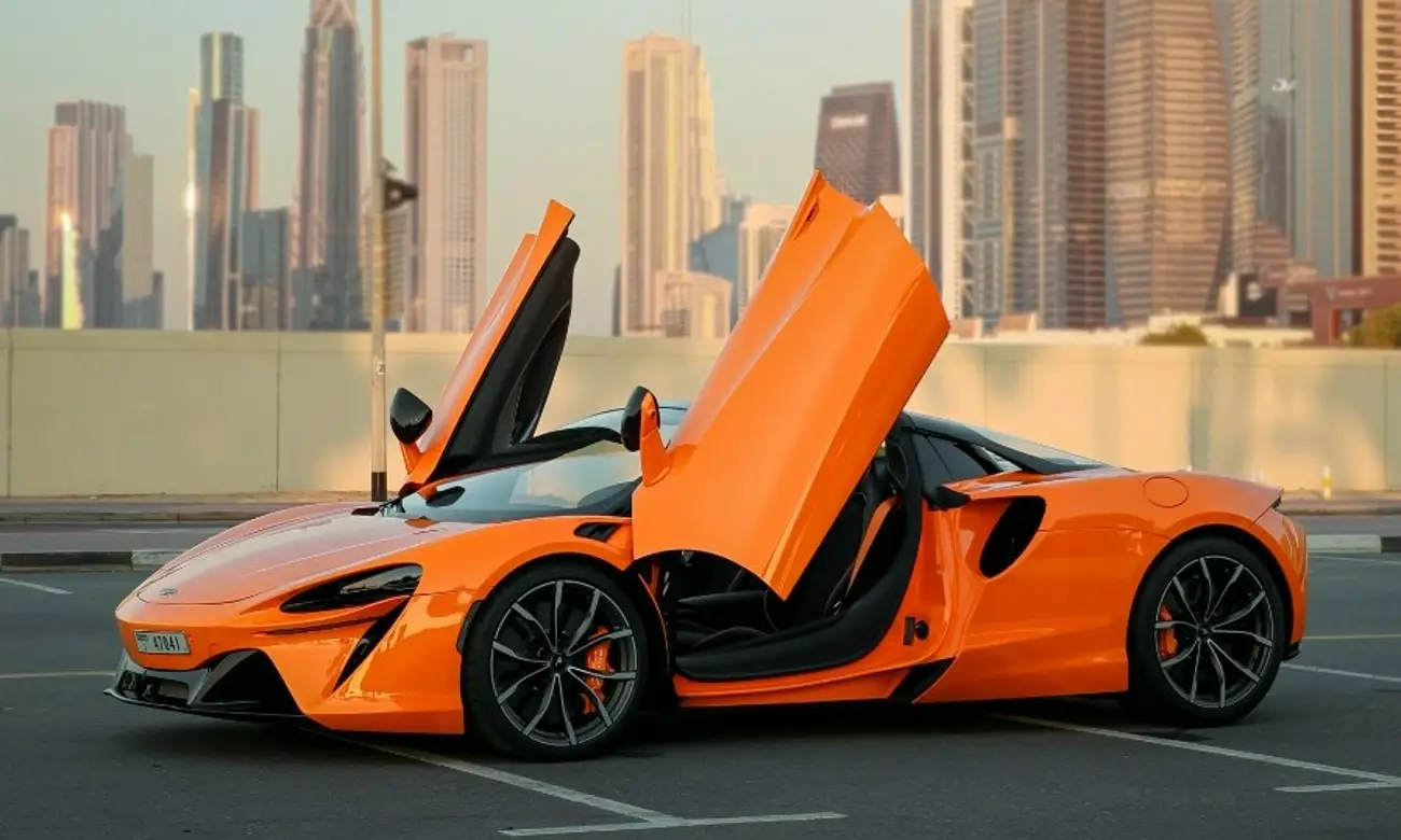 Luxury car driving in Dubai with skyline view