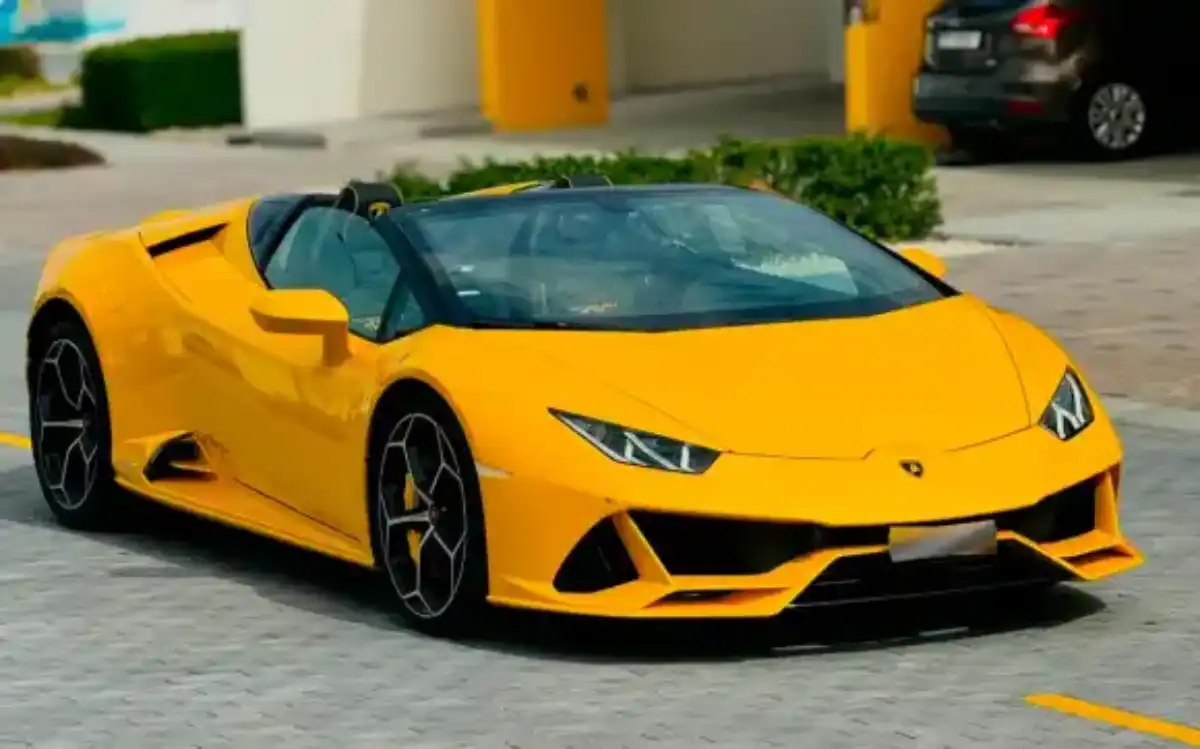 Luxury SUV driving through Dubai skyline