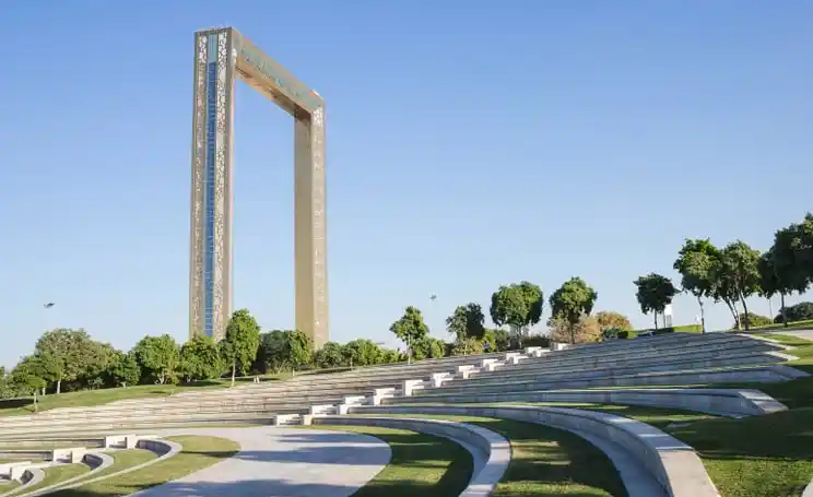 Luxury car driving in Dubai with skyline view